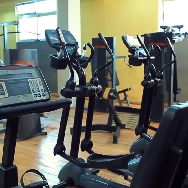 Row of cardio and elliptical machines at Power Gym